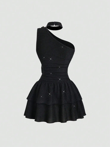 Black Asymmetrical One-Shoulder Dress with Gold Floral Brooch & Tiered Flounce Skirt