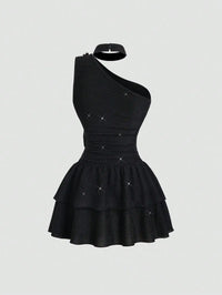 Black Asymmetrical One-Shoulder Dress with Gold Floral Brooch & Tiered Flounce Skirt
