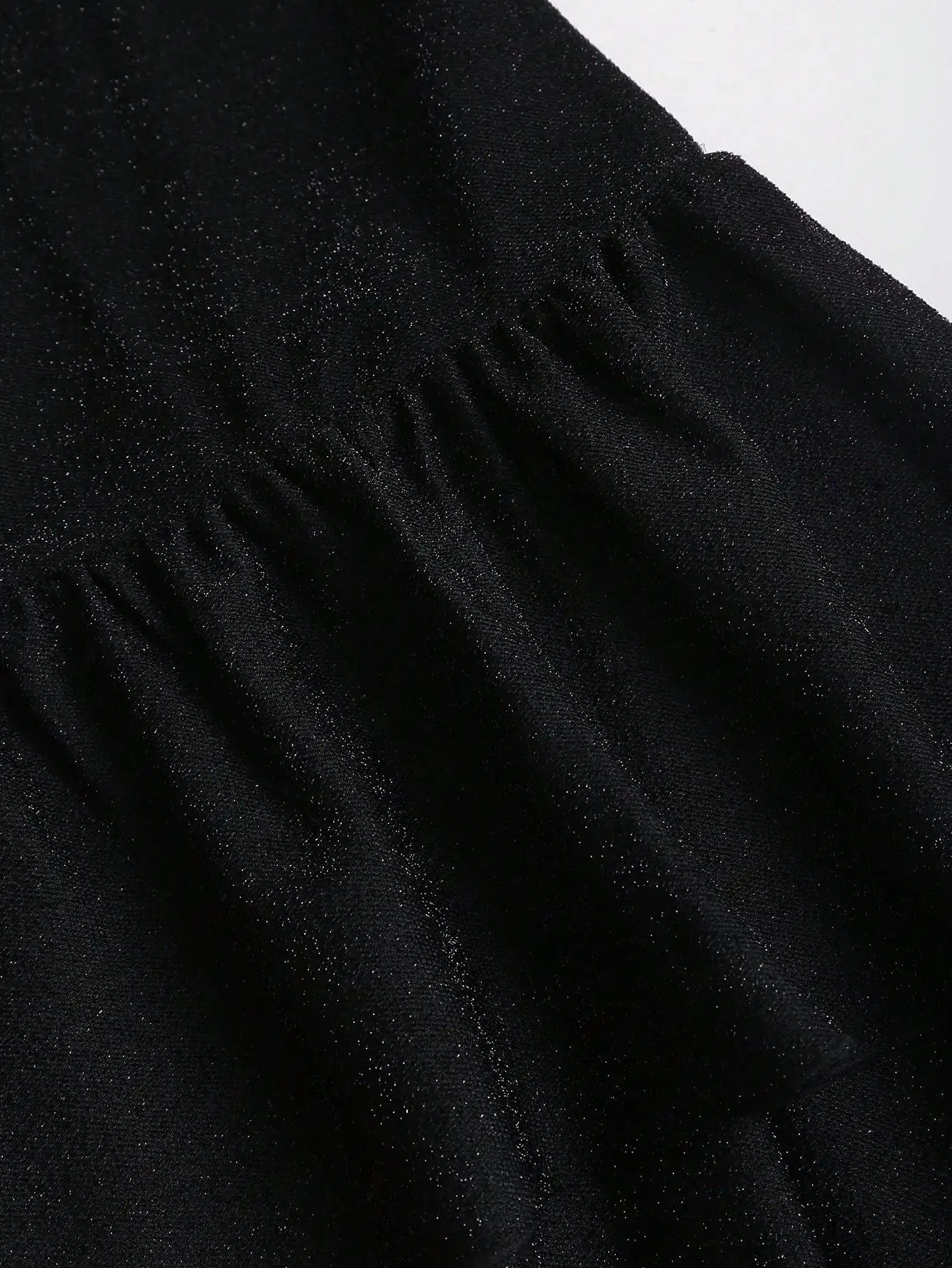 Black Asymmetrical One-Shoulder Dress with Gold Floral Brooch & Tiered Flounce Skirt