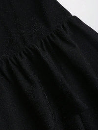 Black Asymmetrical One-Shoulder Dress with Gold Floral Brooch & Tiered Flounce Skirt