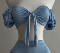 A sexy and fashionable two-piece short skirt with hollowed-out pleated puffed sleeves that wraps the hips